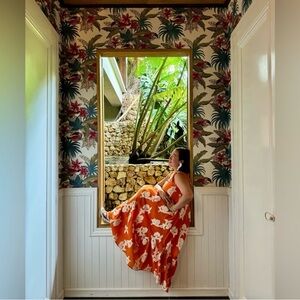EXQUISE for Anthropologie - Vibrant orange dress with cream floral patterns.